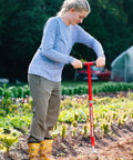 Person using Long Handle Garden Claw For Easy Weeding And Soil Aeration No Bend Tiller Cultivator Twist Weeding Tool outdoors