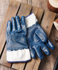 Pro Grade Nitrile Work Gloves Built Tough 10 Pack Blue Heavy Duty Oil And Chemical Resistant Safety Gear With Superior Non Slip Grip on wooden surface.