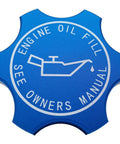 Blue anodized aluminum engine oil filler cap, star-shaped, with oil icon and text 'Engine Oil Fill, See Owners Manual' for various models.