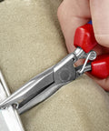 Close-up of Pro Grade 7 Inch Hog Ring Upholstery Pliers for Automotive Seats and Trim Heavy Duty Tool in use securing hog rings.