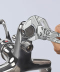 Adjustable Pliers Wrench Set 6 Inch 7 Inch 10 Inch With Smooth Jaws And Push Button Lock gripping a chrome plumbing fixture