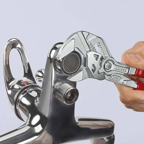 Adjustable Pliers Wrench Set 6 Inch 7 Inch 10 Inch With Smooth Jaws And Push Button Lock gripping a chrome plumbing fixture