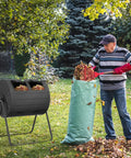 43 Gallon Dual Chamber Tumbler Compost Bin For Outdoor Gardens, Durable Premium Composter, man adding leaves in garden