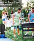 Portable 5 Gallon Electric Water Dispenser With USB Rechargeable Pump at outdoor barbecue event with people cooking and socializing.