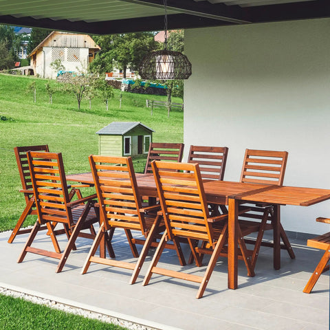 Outdoor patio with 1 Light Outdoor Indoor Plug In Pendant Light With Black Woven Fabric Shade hanging above wooden dining set