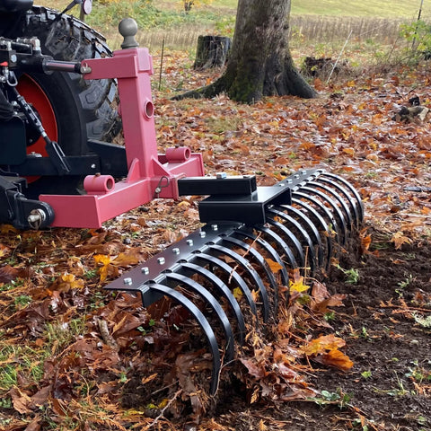 Tow Behind Landscape Rake With 48 Inch Working Width, 17 Steel Tines, 2 Inch Receiver, Fits ATV UTV And 3 Point Hitch in use