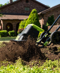 Corded Electric Garden Tiller Cultivator with 12.5 Amp Motor 16 Inch Tilling Width operating in a garden, side view