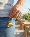 Person holding Sleek Silver Keychain With Chrome Tone Metal Charm, Screw Closure Wire Rope Loop For Keys, Bag Tags, And Daily Carry Grab And Go Ready