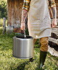 Heavy Duty Fire Pit Carrying Handle With Heat Resistant Stainless Hooks And Durable PU Strap in outdoor setting