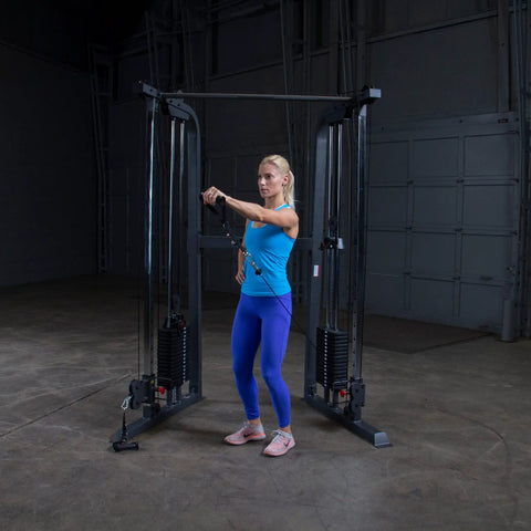 Top Shelf Dual Stack Cable Crossover Machine For Home And Commercial Gyms featuring a woman using dual weight posts with cables.