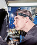 Person working in a workshop wearing Rechargeable COB LED Headlamp With Panoramic Beam Touchless On Off Sensor 400 Lumens