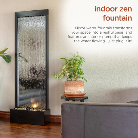 Mirror Waterfall Fountain With Stones And Lights for indoor zen decor in living room, 72 inches tall, water feature with plants nearby.