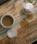 17.71 In By 118 In Distressed Wood Plank Peel And Stick Wallpaper with flower and coffee spill on rustic wood grain pattern