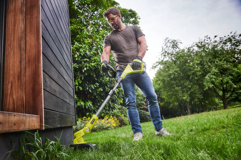 Pro Grade 18 Volt Cordless Grass Trimmer With Dual 2.0 Ah Batteries And Telescopic Handle in action on grass.