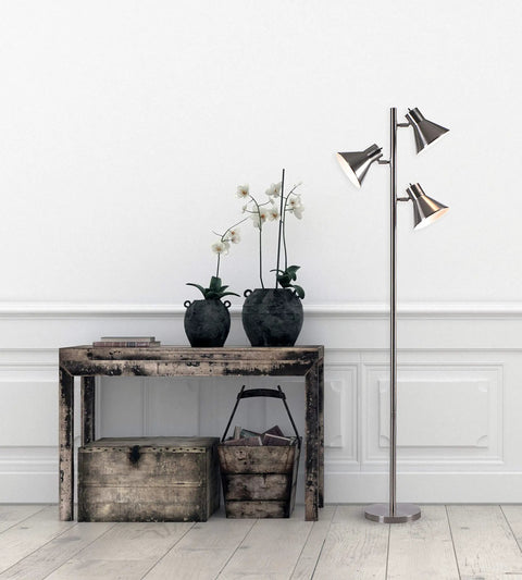 Ash Floor Lamp With Three Adjustable Light Heads In Brushed Steel Tall 64 Inch Modern Floor Lamp next to rustic table in living room.