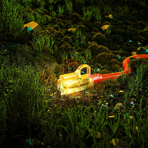 Beefy Outdoor Extension Cord 200 Feet Waterproof 12 Gauge 3 Conductor with Lighted End glowing in grassy terrain
