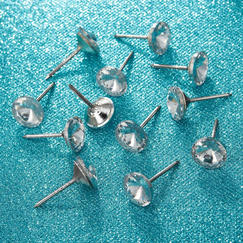 Several 100 Piece Crystal Upholstery Nails And Tacks Set For Furniture Sofas Headboards And Cork Boards on blue surface