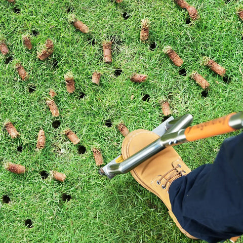 Manual Push Core Aerator Tool For DIY Friendly Healthier Lawn Care With Hollow Tine Inserts on grass, orange handle