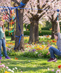 Children playing on Aluminum Zip Line Kit With Heavy Duty Pulleys And Quick Setup Trolley Slider For Backyard Or Park