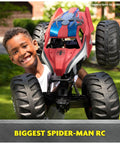 Child holding Spider Man RC Monster Truck Mega Size Over Two Feet Long One Six Scale All Terrain Off Road Toy For Kids Four And Up