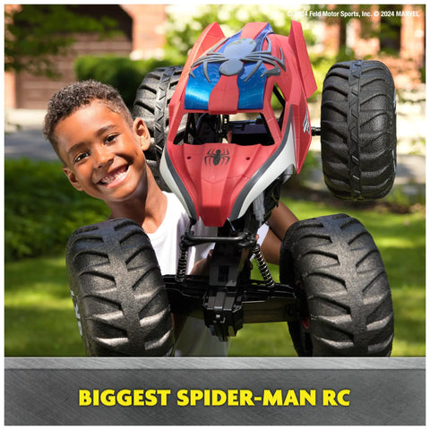 Child holding Spider Man RC Monster Truck Mega Size Over Two Feet Long One Six Scale All Terrain Off Road Toy For Kids Four And Up