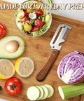 All In One Vegetable Peeler With Wooden Handle And Wide Stainless Steel Blade Perfect For Potatoes And Carrots on cutting board