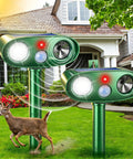 Solar Powered Ultrasonic Deer Repellent Outdoor Deterrent With Motion Sensor Strobe Light That Keeps Rabbits Cats Raccoons Squirrels Out Of Your Garden Yard And Farm Landscaping Protecting Plants In Style 2Pack, two green units in a lawn
