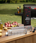 Rolling Grill Basket With Removable Wooden Handle, Extra Sturdy Food Grade Stainless Steel Grill Net Rack on outdoor table
