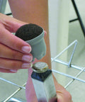 Slip On Floor Savers For Chairs And Tables One And A Quarter Inch Fit For Three Quarters To One And One Eighth Inch Legs Grey Sleeve being applied