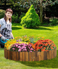 Woman gardening next to a weather resistant pine garden edging border fence for outdoor patio lawns and flower beds 11.8 feet by 8 inches
