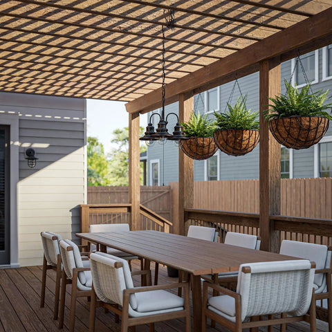 Broadcast 3 Light Outdoor Chandelier in oil rubbed bronze with copper highlight, hanging on patio pergola over dining table, 18x21 inches