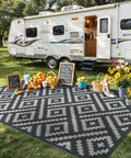 Durable 5x8 Outdoor Rug For Patio And RV Use, Waterproof Reversible Plastic Mat With Dual Sided Geometric Design, Black And Gray near camper