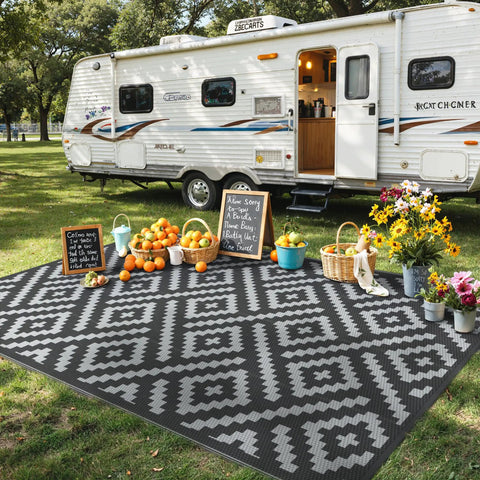 Durable 5x8 Outdoor Rug For Patio And RV Use, Waterproof Reversible Plastic Mat With Dual Sided Geometric Design, Black And Gray near camper