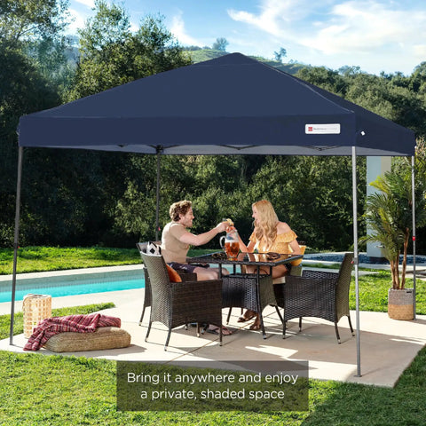 Couple enjoying shade under 10x10 Foot Pop Up Canopy Tent With Grab-And-Go Quick One Person Setup In Under A Minute, Instant Shade At The Park Or Beach, Includes Carry Case And Four Weight Bags, Navy Blue near pool.