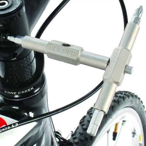 Mountain Bike Tool Kit With Replaceable Sticks And Bracket in use on a bike, showing close-up of tool engagement.