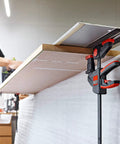 EZR Set Dope One Hand Table And Track Clamp with Quick Release used in woodworking, clamping wood to table, ergonomic design visible.