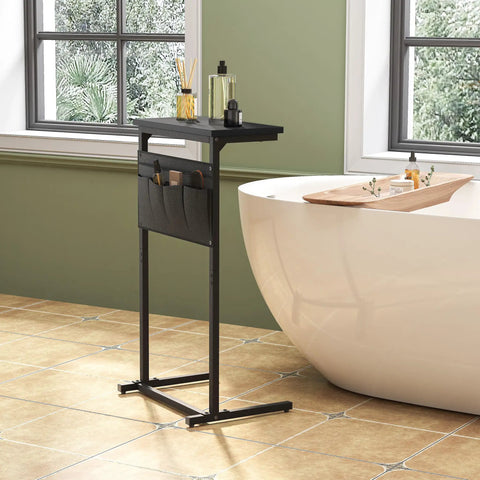 C Shaped End Table For Small Spaces With Storage Bag, black narrow table beside a bathtub with toiletries.
