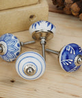Top Shelf 10 Pack Ceramic Cabinet Knobs With Blue And White Printed Antique Patterns Sweet Glossy Finish Drawer Pull Handles For Kitchen Cupboards And Wardrobes. Four unique ceramic knobs displayed on wood.