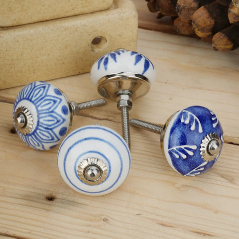 Top Shelf 10 Pack Ceramic Cabinet Knobs With Blue And White Printed Antique Patterns Sweet Glossy Finish Drawer Pull Handles For Kitchen Cupboards And Wardrobes. Four unique ceramic knobs displayed on wood.