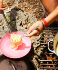 9.4 Inch Long Spork and Spoon Set for Camping and Hiking with Deep Reach Stainless Steel Utensils serving noodles outdoors.