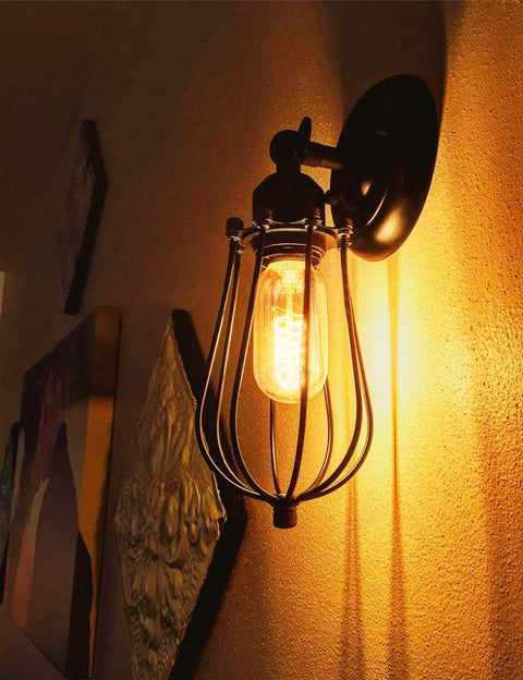 Wall-mounted Vintage Edison Light Bulbs 40 Watt Incandescent Amber Glass Warm White 2700K E26 Base in black cage fixture