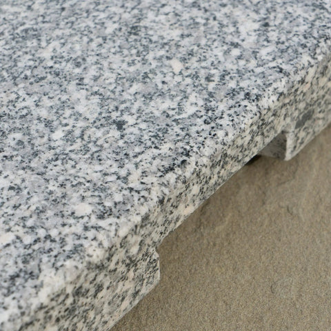 Close-up of natural grey granite surface on Mojave Outdoor Granite And Stainless Steel Umbrella Base Built To Last Heavy Duty 60 Pound Stand