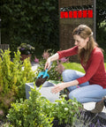 Woman using Long Handled Classic Trowel With Quality Steel And Duroplast Coating For Planting And Transplanting Tall Plants