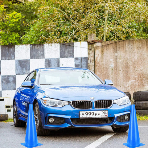 Car navigating blue traffic cones at driving practice area