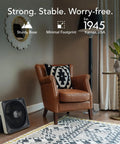 High Velocity Box Fan with Kick Stand, Digital Display, Removable Grille in living room, next to leather chair and plant