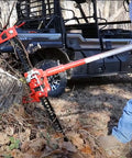Man using Beefy 48 Inch Ratcheting Off Road Utility Farm Jack, 3 Ton Capacity, Lifts From 5.12 To 40 Inches, Red Finish on off-road vehicle.