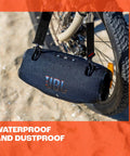 Xtreme 4 Portable Bluetooth Speaker with Beastly Bass hanging on bicycle with IP67 waterproof build, outdoor-ready for adventure.