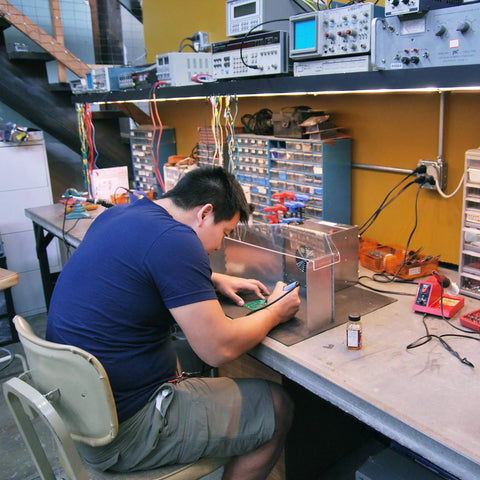 Man using Portable Benchtop Solder Fume Extractor For Soldering Jewelry Making And Crafting With ESD Safe Base And Optional Wings