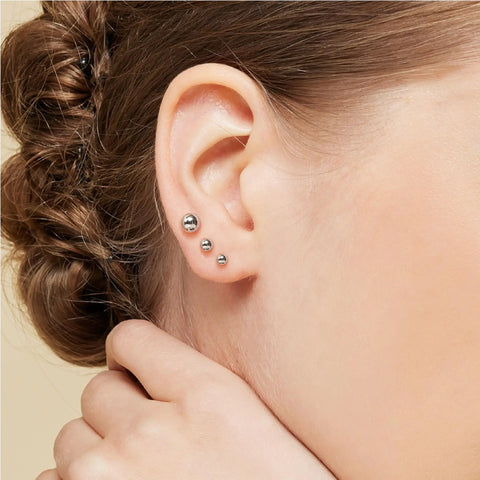 Five Pair Tiny Ball Stud Earrings For Women, Hypoallergenic S925 Sterling Silver Jewelry Set, Five Color Options Rose Gold Gold Silver Black Pearl, Includes Five Sizes For Daily Sparkle. Silver ball stud earrings on ear, three sizes