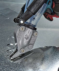 Close-up of Double Cut TurboShear Attachment for drills cutting sheet metal, showing clean edges with power-assisted 18 gauge capacity.